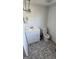 A bathroom showcasing a white vanity with sink, toilet, and decorative floor tiles at 1839 Lakewood Se Ave, Atlanta, GA 30315