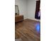 Bedroom with dresser, window and hardwood floors at 1839 Lakewood Se Ave, Atlanta, GA 30315