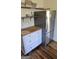 Kitchen with stainless steel refrigerator and butcher block countertop storage at 1839 Lakewood Se Ave, Atlanta, GA 30315