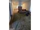 Living room featuring hard wood floors, a decorative carpet, a brown sofa, and brick fireplace at 1839 Lakewood Se Ave, Atlanta, GA 30315