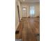 Spacious room with hardwood flooring, front door, and window at 1839 Lakewood Se Ave, Atlanta, GA 30315