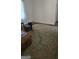 Living room features a large decorative rug, an ottoman and leather couch at 1839 Lakewood Se Ave, Atlanta, GA 30315
