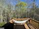 Wooden deck with a hammock with a view of the surrounding woods at 15 Huntington Dr, Grantville, GA 30220