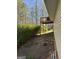 A view of the backyard and deck of the home from the side at 15 Huntington Dr, Grantville, GA 30220