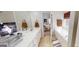 Bathroom with a white double sink vanity, soaking tub, and view to the bedroom at 15 Huntington Dr, Grantville, GA 30220