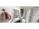 Granite-top vanity in a bathroom featuring a shower with a black and white curtain at 15 Huntington Dr, Grantville, GA 30220