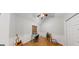 Small bedroom with wainscotting, wood floors and a single window at 15 Huntington Dr, Grantville, GA 30220