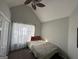 Cozy bedroom with a comfortable bed, fan, and bright window at 15 Huntington Dr, Grantville, GA 30220