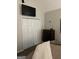 Bedroom with bi-fold closet, dark dresser and mounted television at 15 Huntington Dr, Grantville, GA 30220