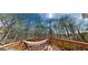 Relaxing deck view featuring a hammock and a view of a wooded area at 15 Huntington Dr, Grantville, GA 30220