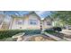 Charming home featuring symmetrical design, neutral siding, and well-maintained landscaping at 15 Huntington Dr, Grantville, GA 30220