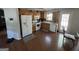 Bright kitchen with appliances, oak cabinetry and hardwood floors at 15 Huntington Dr, Grantville, GA 30220