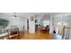 Open-concept living space with hardwood floors, fireplace, and ample natural light at 15 Huntington Dr, Grantville, GA 30220