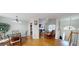 Open-concept living space with hardwood floors, fireplace, and ample natural light at 15 Huntington Dr, Grantville, GA 30220