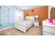Colorful bedroom with unique wall decor and white bed at 12046 Conrad Cir # 100, Hampton, GA 30228