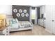 Charming bedroom with decorative wall art and dresser at 12046 Conrad Cir # 100, Hampton, GA 30228