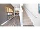 Bright entryway with stylish console table and stairs at 12046 Conrad Cir # 100, Hampton, GA 30228