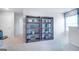 Bright hallway with built-in shelving and neutral decor at 12046 Conrad Cir # 100, Hampton, GA 30228