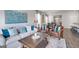 Spacious living room with comfortable seating and large art at 12046 Conrad Cir # 100, Hampton, GA 30228