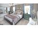 Spacious main bedroom with large bed, two nightstands, and ceiling fan at 12046 Conrad Cir # 100, Hampton, GA 30228