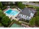 Aerial view of community pool, clubhouse, and tennis courts at 803 Natchez Ct, Peachtree City, GA 30269