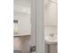 Small bathroom with pedestal sink and mirror at 12116 Conrad Cir # 114, Hampton, GA 30228