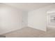 Simple bedroom with carpet and door to another room at 12116 Conrad Cir # 114, Hampton, GA 30228