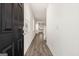 Bright entry hall with hardwood floors and view of kitchen at 12116 Conrad Cir # 114, Hampton, GA 30228