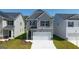 Two-story house with gray siding, and a two-car garage at 12116 Conrad Cir # 114, Hampton, GA 30228