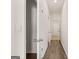 Bright hallway with wood-look flooring and closet at 12116 Conrad Cir # 114, Hampton, GA 30228