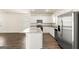 Modern kitchen with white cabinets, granite countertops, and stainless steel appliances at 12116 Conrad Cir # 114, Hampton, GA 30228
