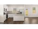 Modern kitchen with white cabinets, granite countertops, and stainless steel appliances at 12116 Conrad Cir # 114, Hampton, GA 30228