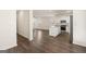 Open concept kitchen and living area with hardwood floors at 12116 Conrad Cir # 114, Hampton, GA 30228