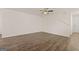 Spacious living room featuring hardwood floors and ceiling fan at 12116 Conrad Cir # 114, Hampton, GA 30228