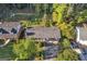 Aerial view of home with mature trees and a long drive at 2145 Sandgate Cir, South Fulton, GA 30349