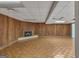 Basement with wood paneling and brick fireplace at 2145 Sandgate Cir, South Fulton, GA 30349
