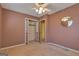 Bedroom featuring carpet, closet, and a ceiling fan with light fixture at 2145 Sandgate Cir, South Fulton, GA 30349