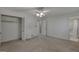 Bedroom with a ceiling fan and lighting, carpet, and an open closet at 2145 Sandgate Cir, South Fulton, GA 30349