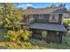 Back exterior of house with screened in patio and wooden deck at 2145 Sandgate Cir, South Fulton, GA 30349