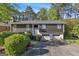 Two-story home featuring wood siding, brick accents, and a two-car garage at 2145 Sandgate Cir, South Fulton, GA 30349
