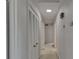 Hallway with closet and neutral paint and carpet throughout the home at 2145 Sandgate Cir, South Fulton, GA 30349