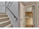 Staircase to the basement with an open door to the basement at 2145 Sandgate Cir, South Fulton, GA 30349
