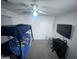 This cozy bedroom features carpet, a ceiling fan, and a bunk bed at 261 Coral Cir, Mcdonough, GA 30253
