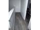 The hallway has wood floors and white walls with an open doorway at 261 Coral Cir, Mcdonough, GA 30253