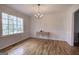 Inviting dining room with hardwood floors and a large window providing natural light and backyard views at 731 Willow Ridge Dr, Marietta, GA 30068