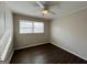 Neutral bedroom featuring plank flooring, fan and window at 422 Windsor Dr, Forest Park, GA 30297
