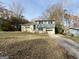 Charming two-story home with brick and blue siding with an attached garage at 422 Windsor Dr, Forest Park, GA 30297