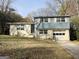 Charming two-story home with brick and blue siding on a tree filled lot at 422 Windsor Dr, Forest Park, GA 30297
