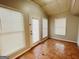 Bright sun room featuring tile floors, multiple windows, and a door to the outside at 422 Windsor Dr, Forest Park, GA 30297