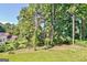 View of backyard with a large wooded area at 633 Mill Creek Trl, Jonesboro, GA 30238